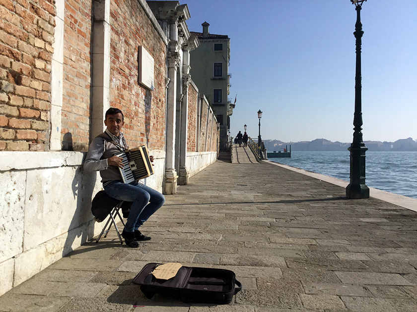 The man and the wall. I encountered this street musician during my recent visit to Venice, Italy in February 2017.